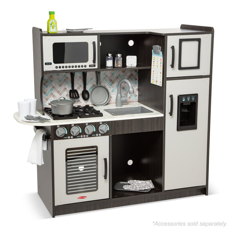 The loose pieces of The Melissa & Doug Chef's Wooden Pretend Play Kitchen for Kids With “Ice” Cube Dispenser – Charcoal Gray