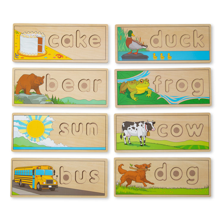 The loose pieces of The Melissa & Doug See & Spell Wooden Educational Toy With 8 Double-Sided Spelling Boards and 64 Letters