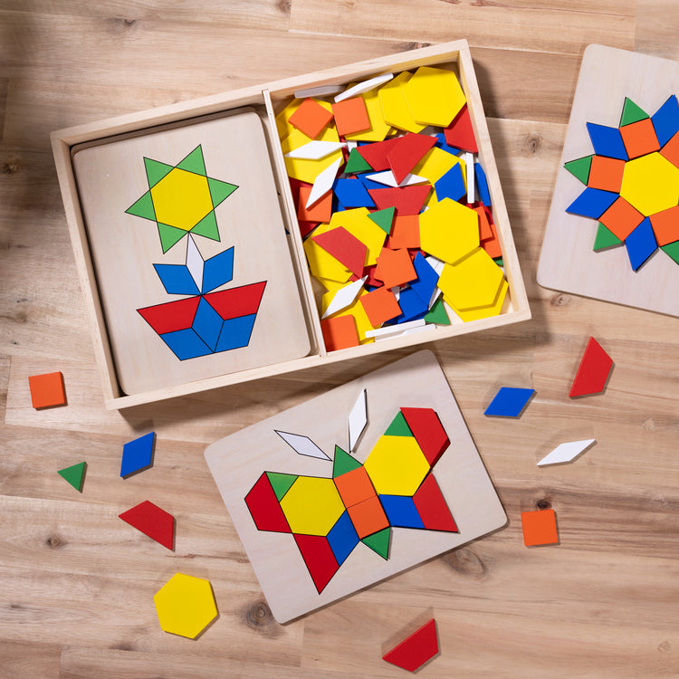 A playroom scene with The Melissa & Doug Pattern Blocks and Boards - Classic Toy With 120 Solid Wood Shapes and 5 Double-Sided Panels, Multi-Colored Animals Puzzle