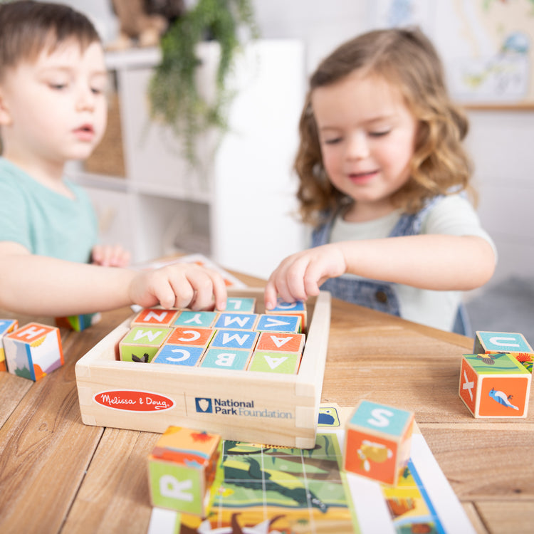 A playroom scene with The Melissa & Doug National Parks Alphabet & Animals 24-Piece Cube Puzzle (Everglades, Arches, Yellowstone)