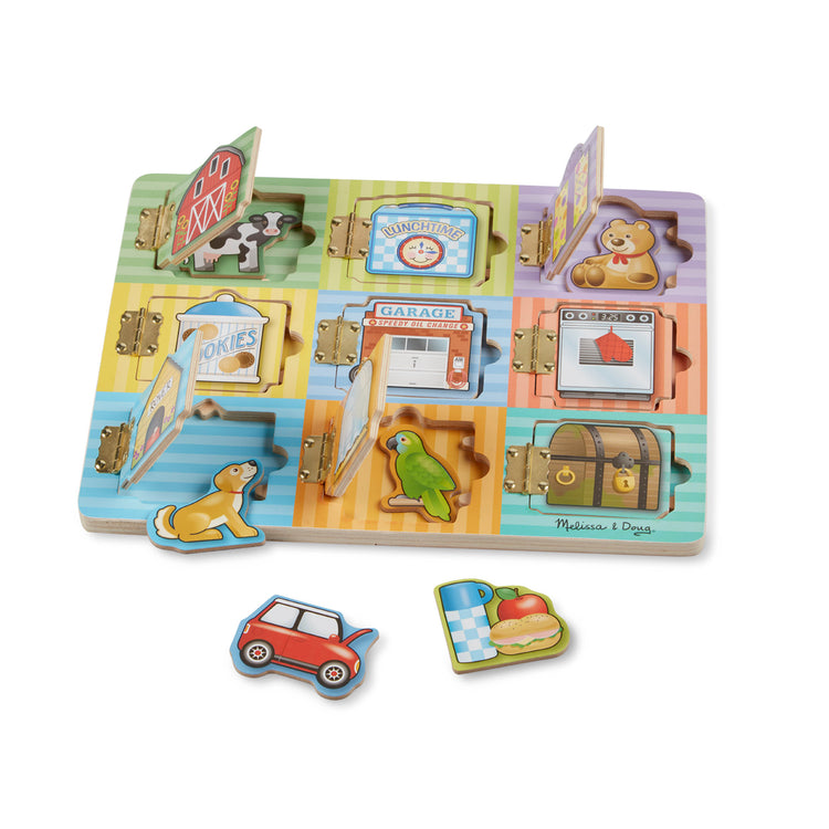 The loose pieces of The Melissa & Doug Hide and Seek Wooden Activity Board With Wooden Magnets