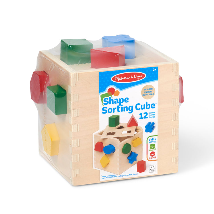 The front of the box for The Melissa & Doug Shape Sorting Cube - Classic Wooden Toy With 12 Shapes