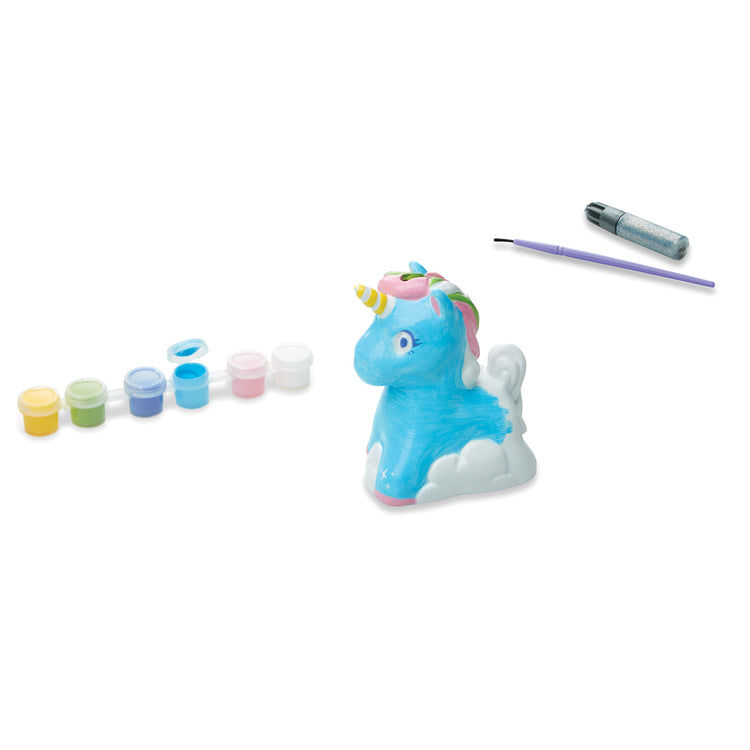 The loose pieces of The Melissa & Doug Created by Me! Decorate-Your-Own Unicorn Bank Craft Kit With 6 Pots of Paint, Glitter Glue, Paintbrush