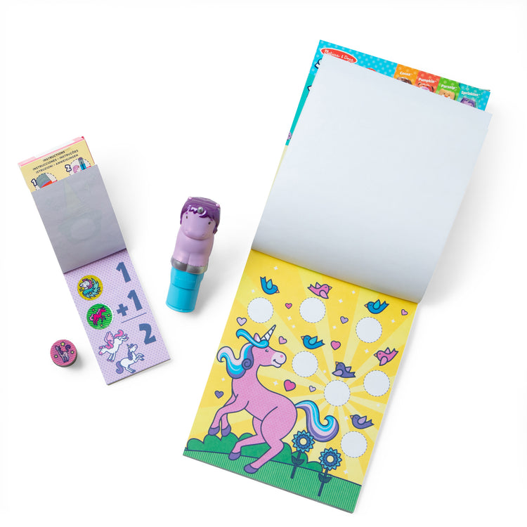 The loose pieces of The Melissa & Doug Sticker WOW!™ Purple Unicorn Bundle: 24-Page Activity Pad, Sticker Stamper, 500 Stickers, Arts and Crafts Fidget Toy Collectible Character