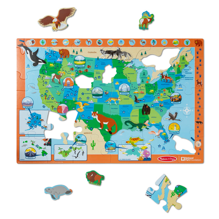 The loose pieces of The Melissa & Doug National Parks U.S.A. Map Floor Puzzle – 45 Jumbo and Animal Shaped Pieces, Search-and-Find Activities, Park and Animal ID Guide