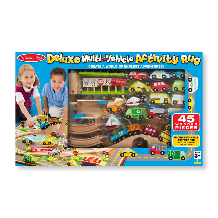 The front of the box for The Melissa & Doug Deluxe Multi-Vehicle Activity Rug (39.5" x 36.5") - 19 Vehicles, 12 Wooden Signs, Train Tracks