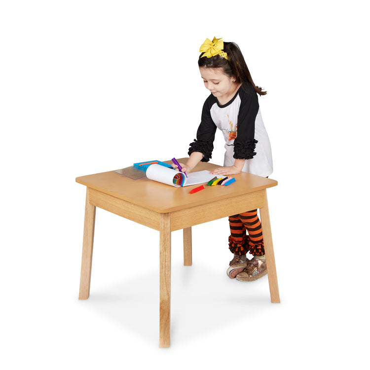 A child on white background with The Wooden Square Table (Natural)