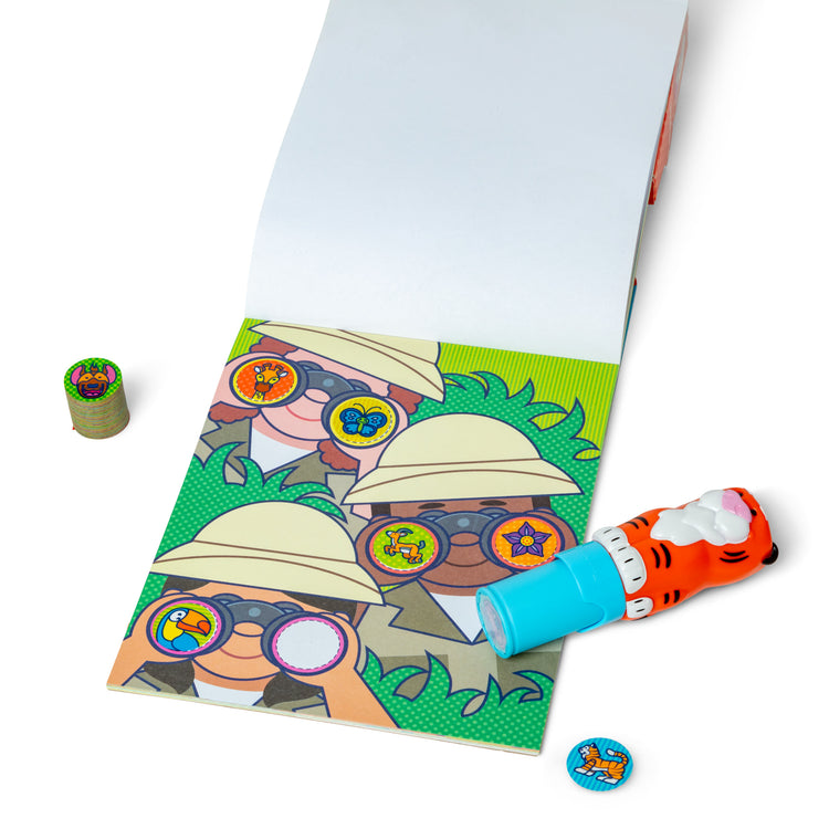 The loose pieces of The Melissa & Doug Sticker WOW!™ Tiger Bundle: 24-Page Activity Pad, Sticker Stamper, 500 Stickers, Arts and Crafts Fidget Toy Collectible Character