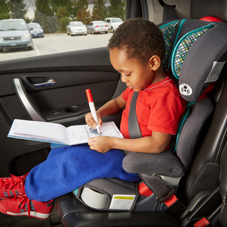 A kid playing with The Melissa & Doug On the Go ColorBlast! Activity Book: Sea Life - 24 Pictures and No-Mess Pen