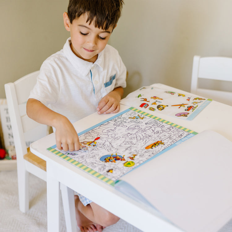 A kid playing with The Melissa & Doug Wooden Square Table (White)