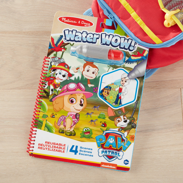 A playroom scene with The Melissa & Doug PAW Patrol Water Wow! - Skye Water Reveal Travel Activity Pad