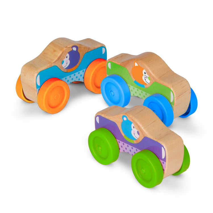 The loose pieces of The Melissa & Doug First Play Wooden Animal Stacking Cars (3 pcs)