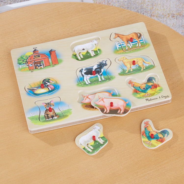 A playroom scene with The Melissa & Doug Farm Sound Puzzle - Wooden Peg Puzzle With Sound Effects (8 pcs)