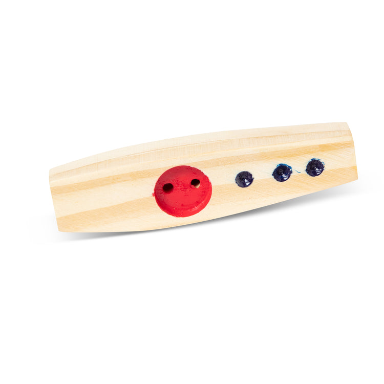 The loose pieces of The Melissa & Doug Makin' Music Beginner Wooden Kazoo