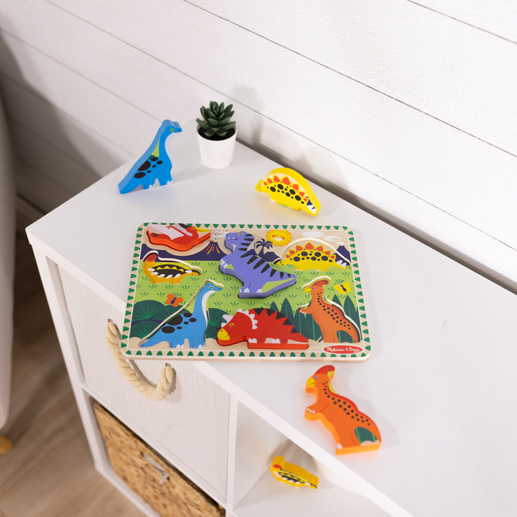 A playroom scene with The Melissa & Doug Dinosaur Wooden Chunky Puzzle (7 pcs)