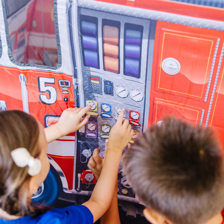 A kid playing with The Melissa & Doug Fire Truck Play Tent