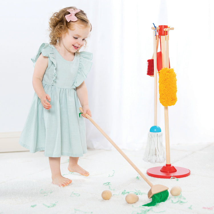 girl playing with dust sweep mop toy
