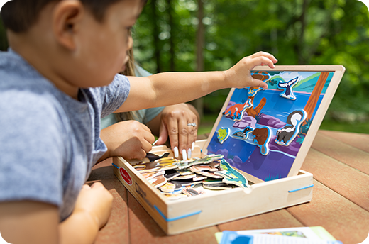 Child playing with Parks Magnetic Picture Game