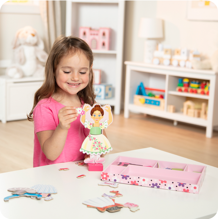 child playing with doll toys