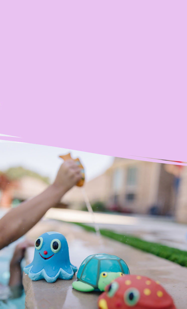 child playing with outdoor toys