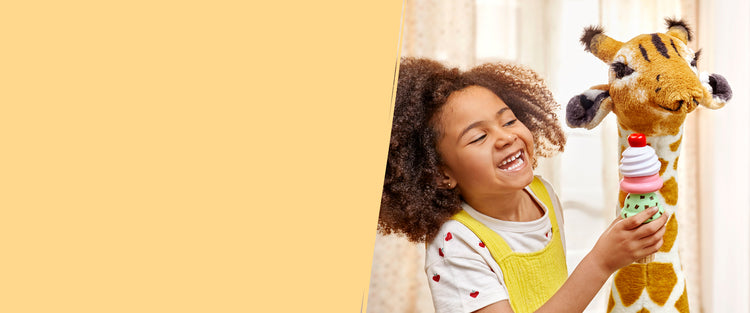 child playing with giraffe and ice cream toys