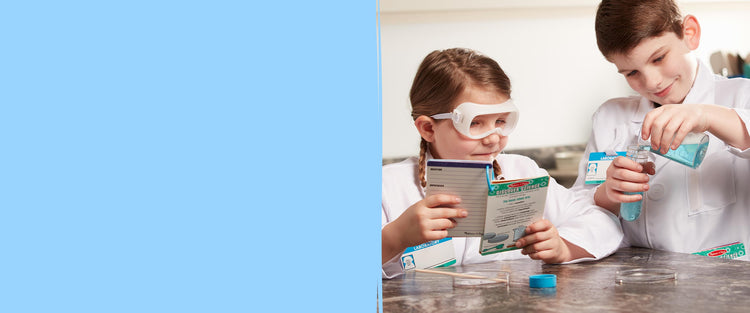 image of children playing with science experiement toys