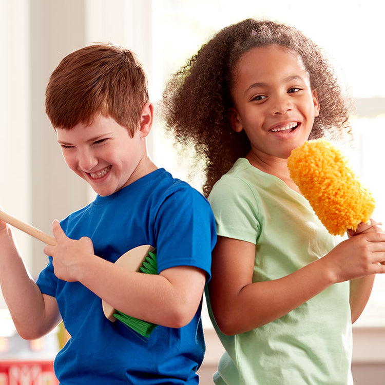 children playing with pretend play broom toy