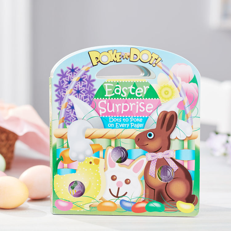 A playroom scene with The Melissa & Doug Children’s Book – Poke-a-Dot: Easter Surprise