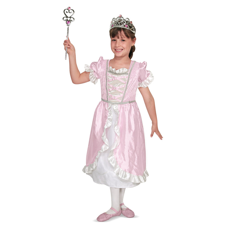 A child on white background with The Melissa & Doug Princess Role Play Costume Set (3 pcs)- Pink Gown, Tiara, Wand