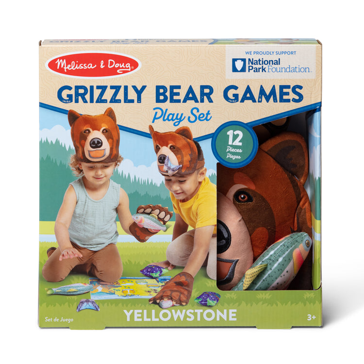 The front of the box for The Melissa & Doug Yellowstone National Park Grizzly Bear Games and Pretend Play Set with Plush Bear Heads and Bear Paw Gloves