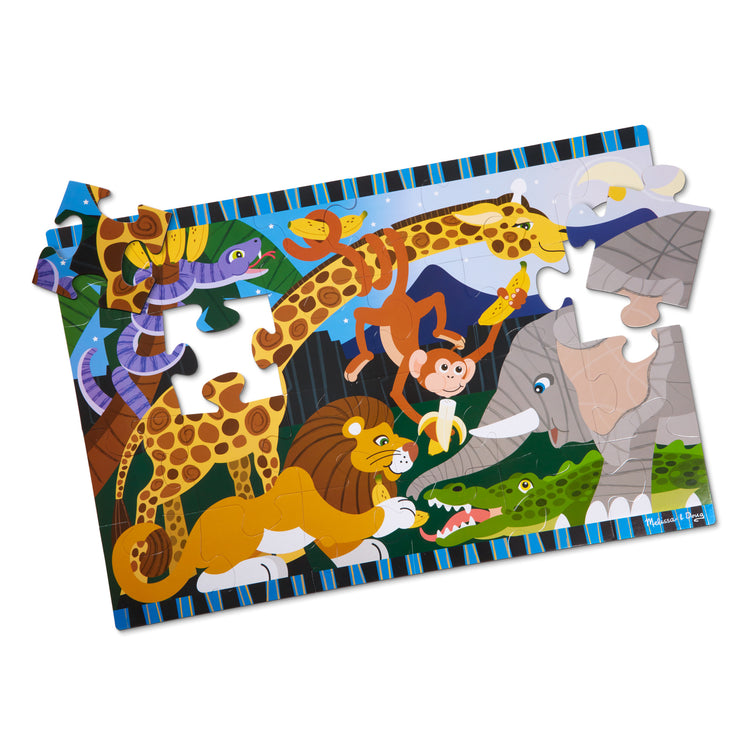 The loose pieces of The Melissa & Doug Safari Social Jumbo Jigsaw Floor Puzzle (24 pcs, 2 x 3 feet)