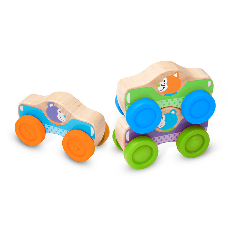 The loose pieces of The Melissa & Doug First Play Wooden Animal Stacking Cars (3 pcs)