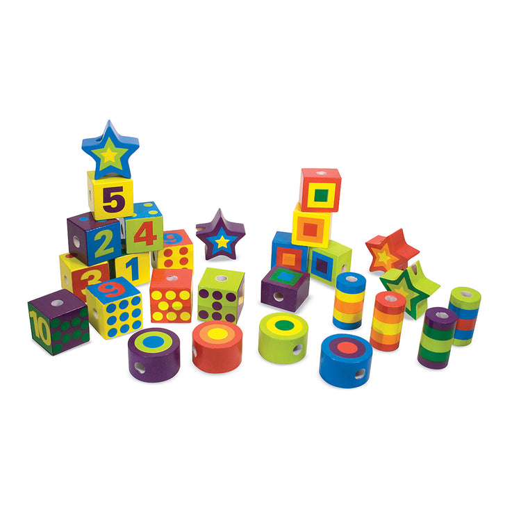 The loose pieces of The Melissa & Doug Deluxe Wooden Lacing Beads - Educational Activity With 27 Beads and 2 Laces