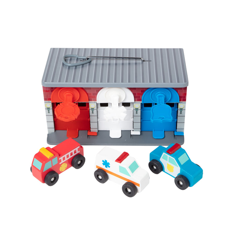 The loose pieces of The Melissa & Doug Toy Keys and Cars Wooden Rescue Vehicles and Garage (7 pcs)