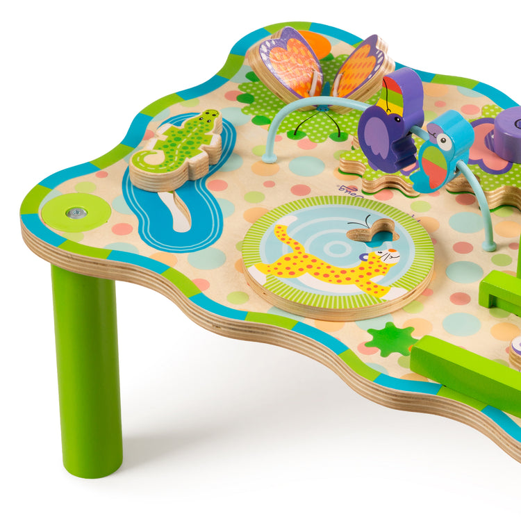 The loose pieces of The Melissa & Doug First Play Children’s Jungle Wooden Activity Table for Toddlers