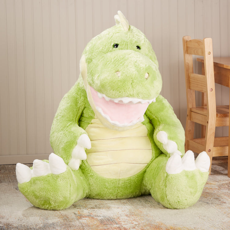 A playroom scene with The Melissa & Doug Gentle Jumbos Dinosaur Giant Stuffed Plush Animal (Sits Nearly 3 Feet Tall)