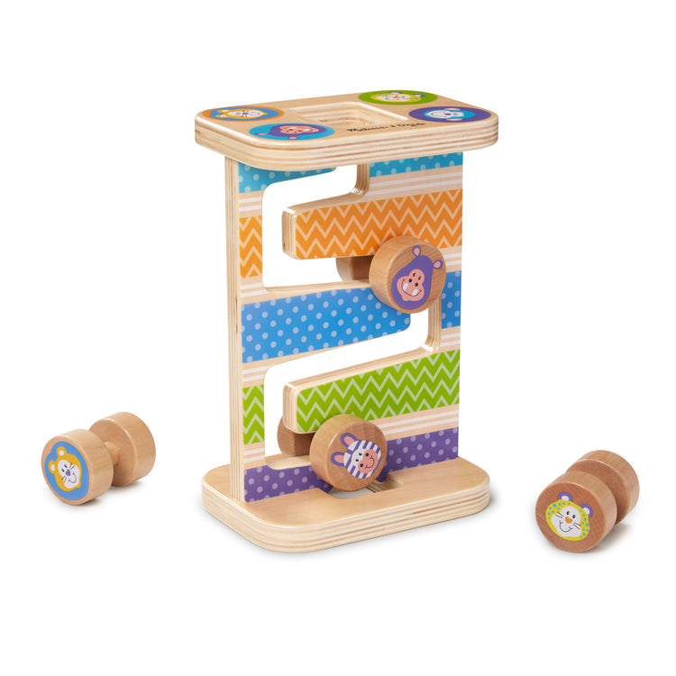 The loose pieces of The Melissa & Doug First Play Wooden Safari Zig-Zag Tower With 4 Rolling Pieces