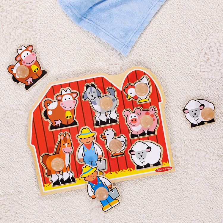 A playroom scene with The Melissa & Doug Farm Animals Jumbo Knob Wooden Puzzle