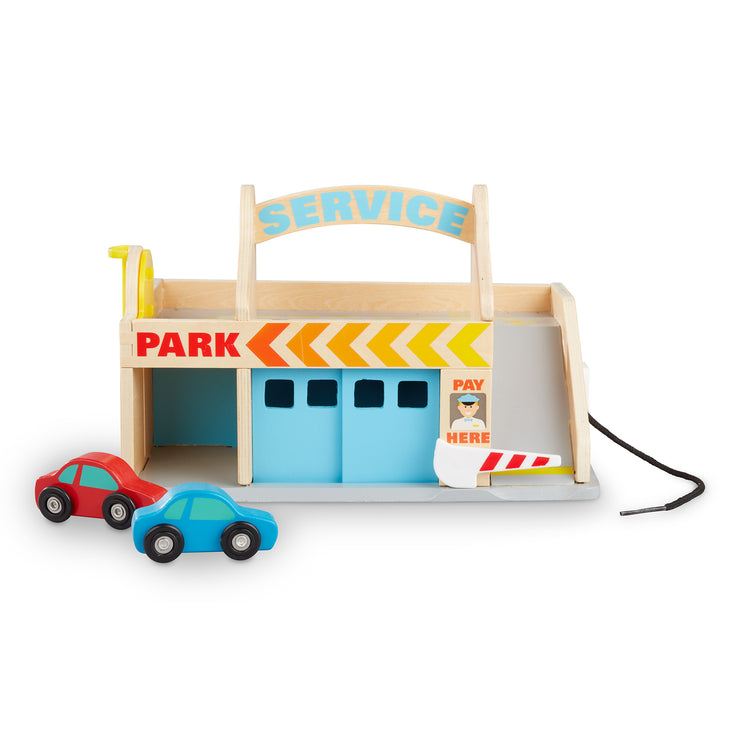 The loose pieces of The Melissa & Doug Service Station Parking Garage With 2 Wooden Cars and Drive-Thru Car Wash