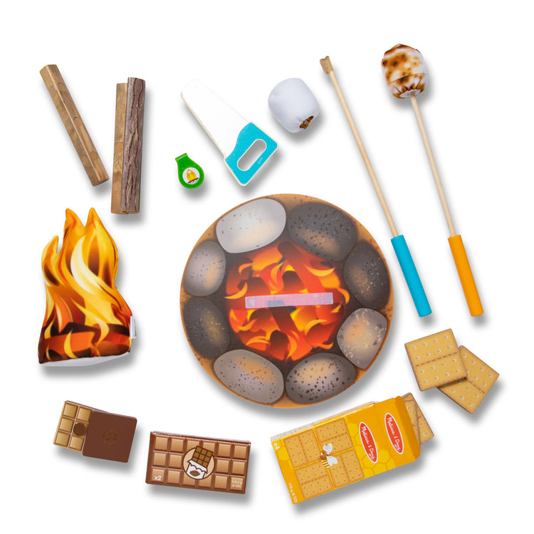 The loose pieces of The Melissa & Doug Let's Explore Campfire S'Mores Play Set