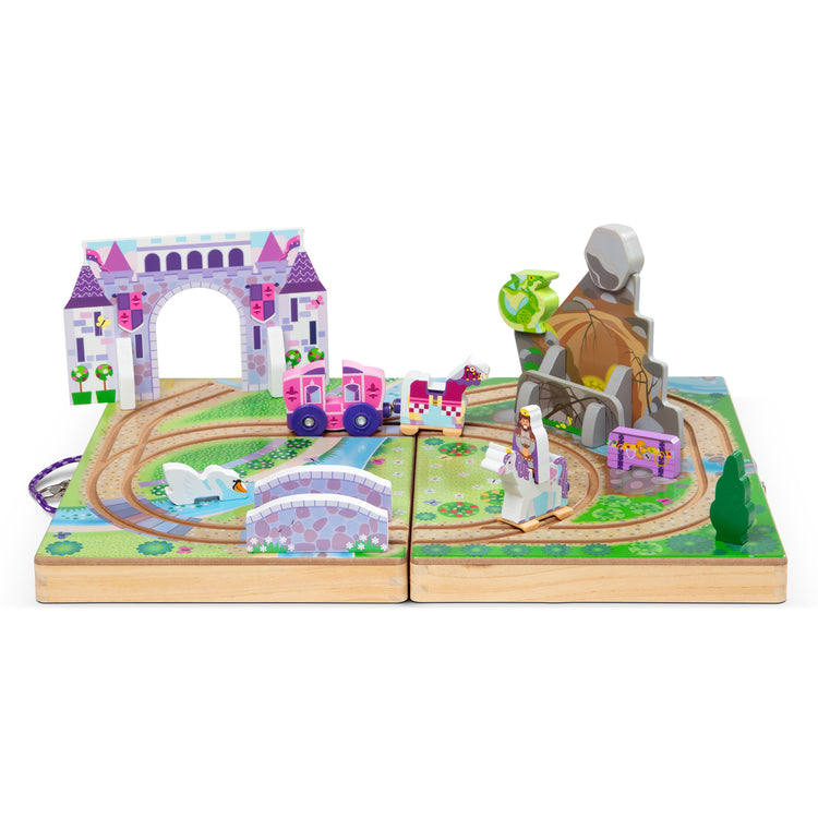 An assembled or decorated The Melissa & Doug 19-Piece Wooden Take-Along Tabletop Kingdom – Carriage, Horse, Unicorn, Dragon, More