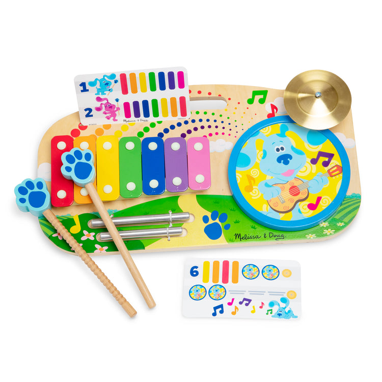 The loose pieces of The Melissa & Doug Blue's Clues & You! Wooden Music Maker Board (5 Instruments)