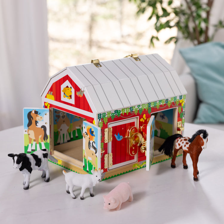 A playroom scene with The Melissa & Doug Latches Wooden Activity Barn with 5 Doors, 4 Play Figure Farm Animals