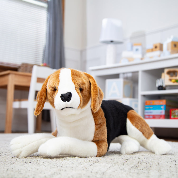 A playroom scene with The Melissa & Doug Lifelike Plush Beagle Stuffed Animal