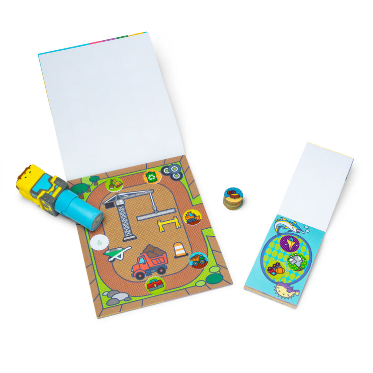 An assembled or decorated The Melissa & Doug Sticker WOW!™ Bulldozer Bundle: 24-Page Activity Pad, Sticker Stamper, 500 Stickers, Arts and Crafts Fidget Toy Collectible Character