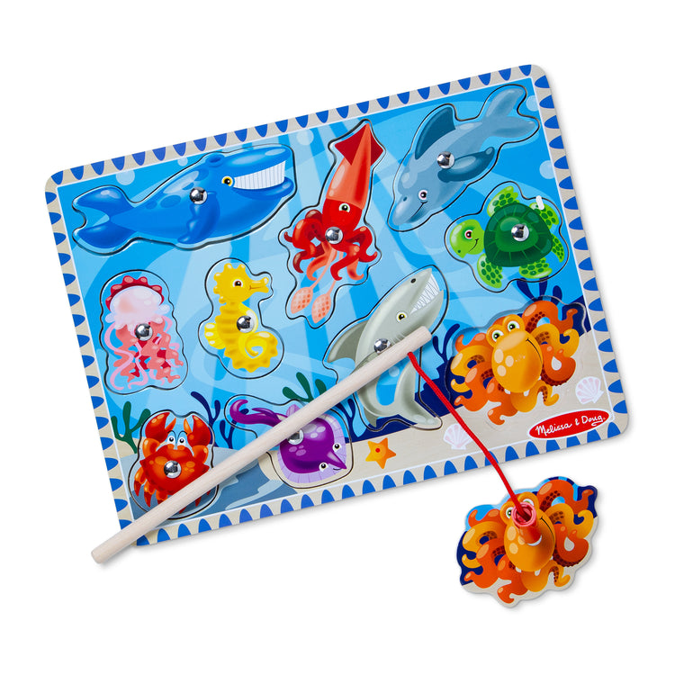 A kid playing with The Melissa & Doug Magnetic Wooden Fishing Game and Puzzle With Wooden Ocean Animal Magnets