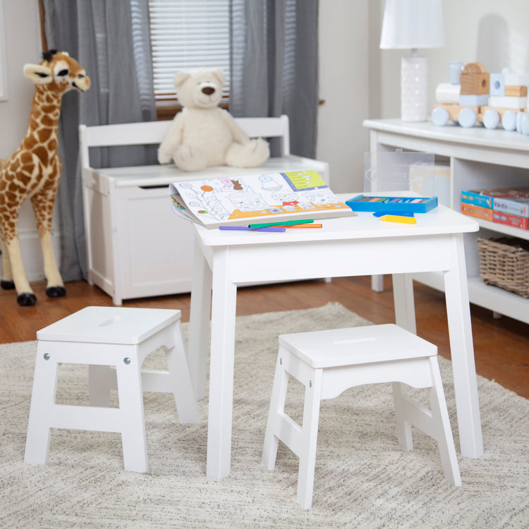 A playroom scene with The Melissa & Doug Wooden Square Table (White)