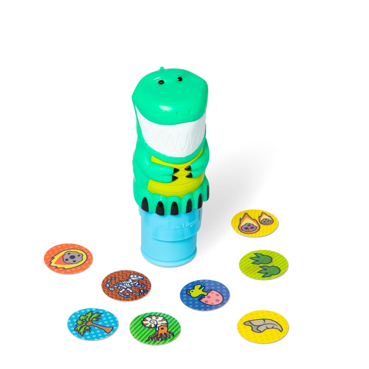 The loose pieces of The Melissa & Doug Sticker WOW!™ Dinosaur Bundle: 24-Page Activity Pad, Sticker Stamper, 500 Stickers, Arts and Crafts Fidget Toy Collectible Character 