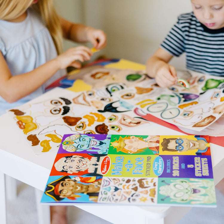 A kid playing with The Melissa & Doug Make-a-Face Sticker Pad - Crazy Characters, 20 Faces, 5 Sticker Sheets