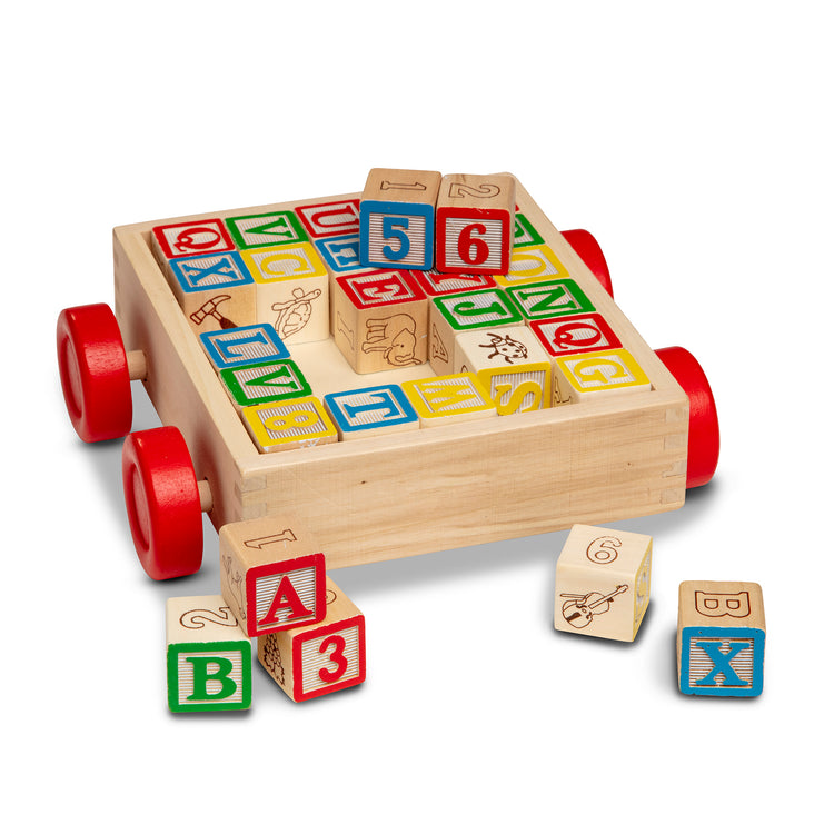 The loose pieces of The Melissa & Doug Classic ABC Wooden Block Cart Educational Toy With 30 1-Inch Solid Wood Blocks